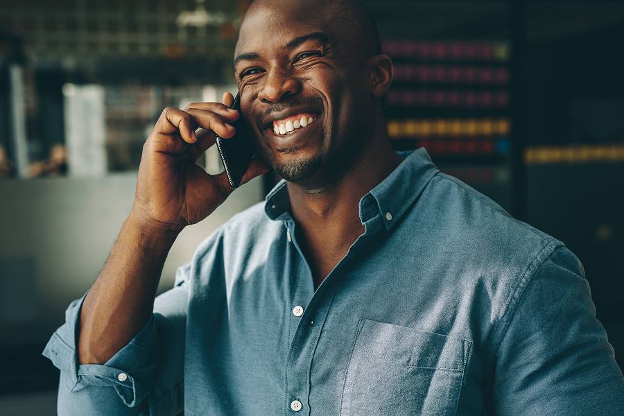 A male employee using his mobile phone